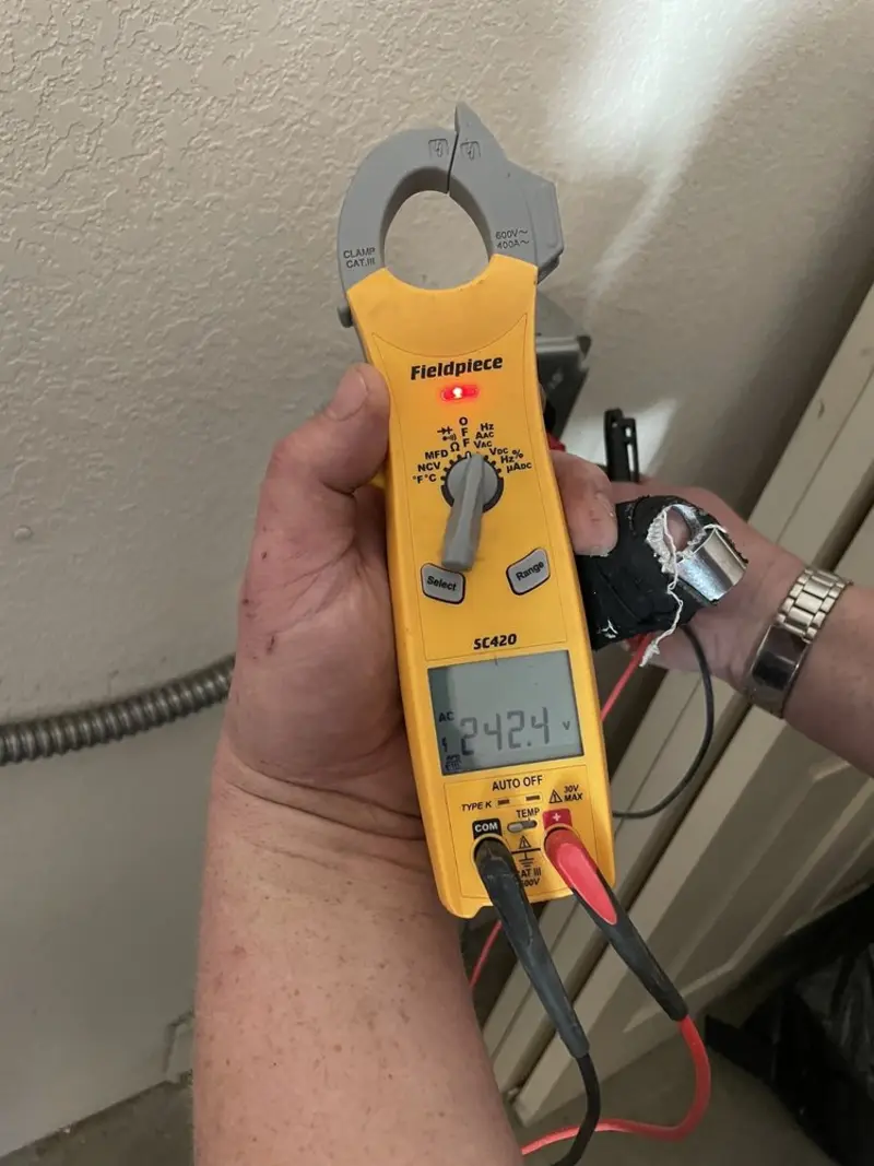 Voltage testing with clamp meter during Circuit Breaker Repair in Tilton